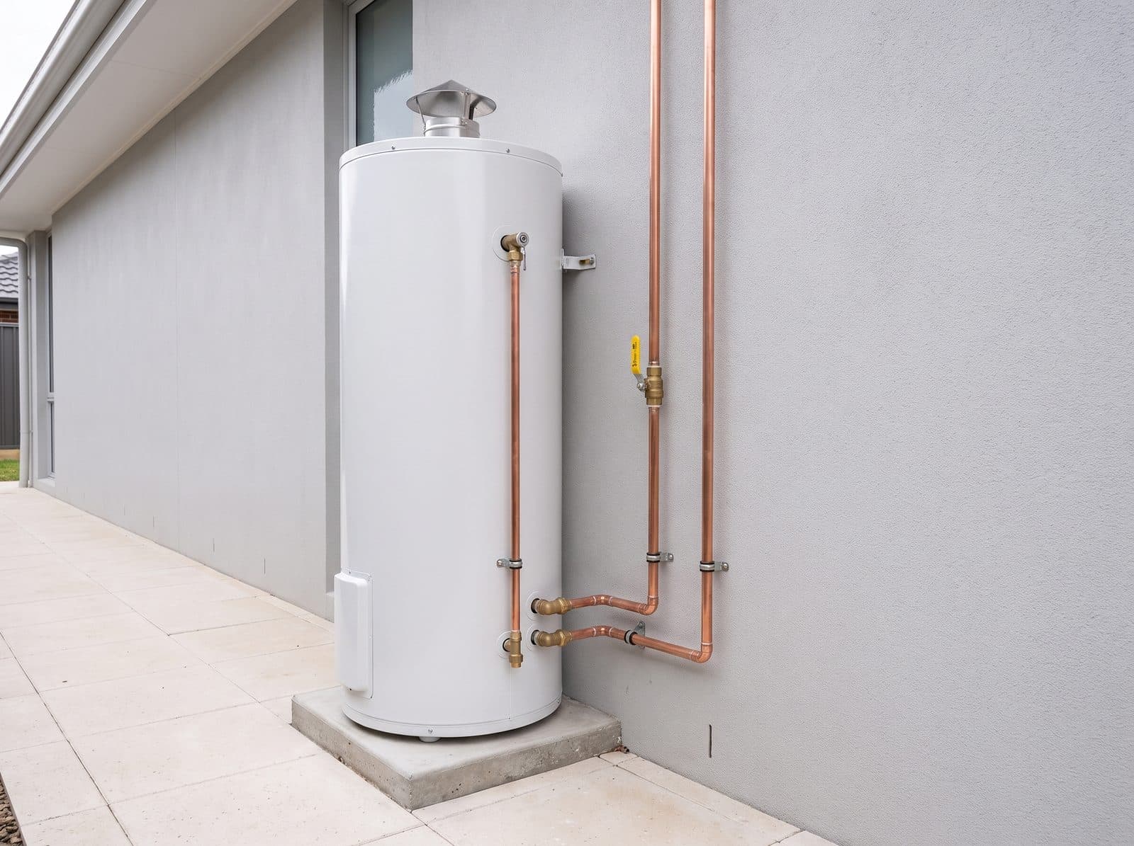 Gas hot water storage tank installed outside a home