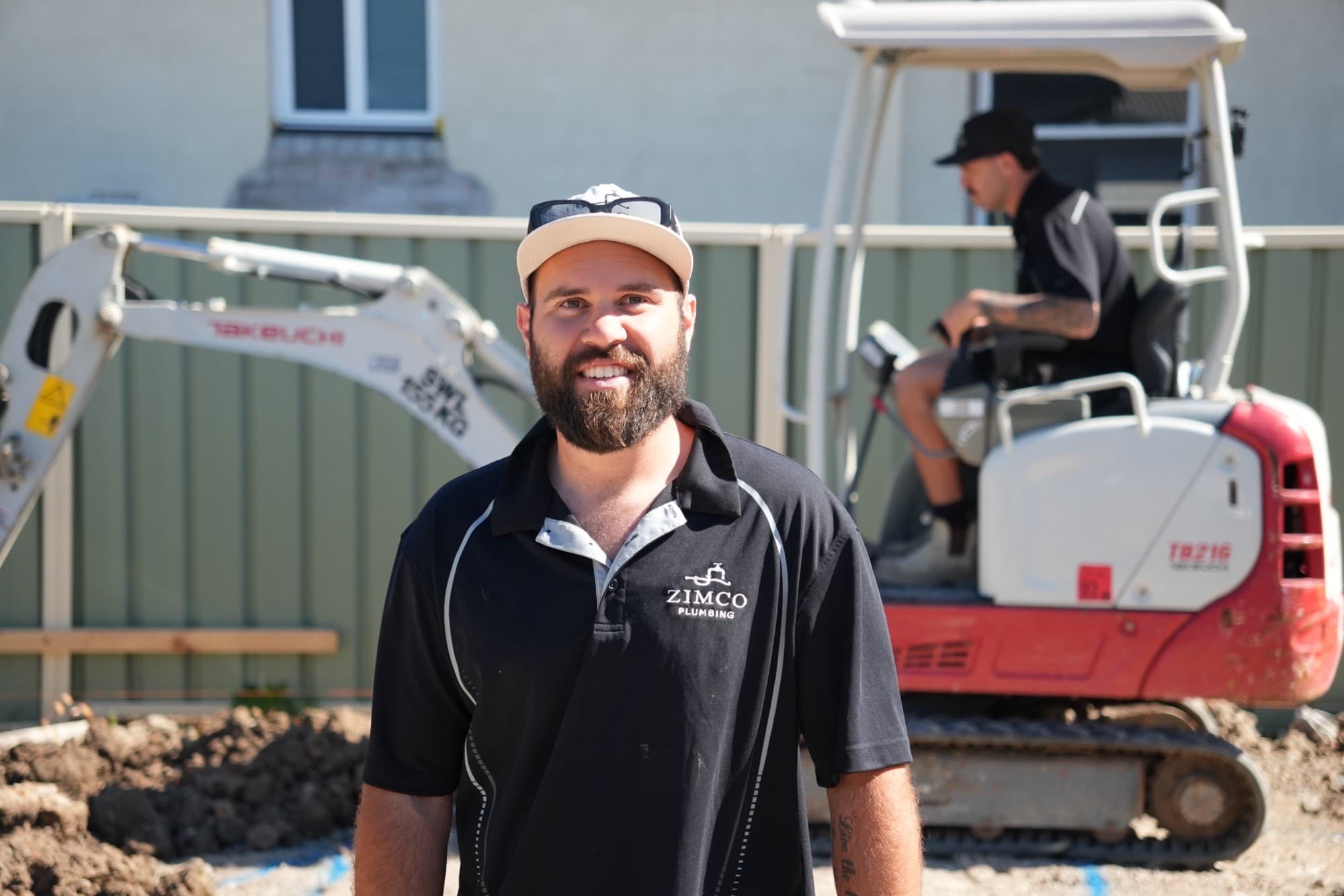 Zimco Plumbing crew member on site with the excavator